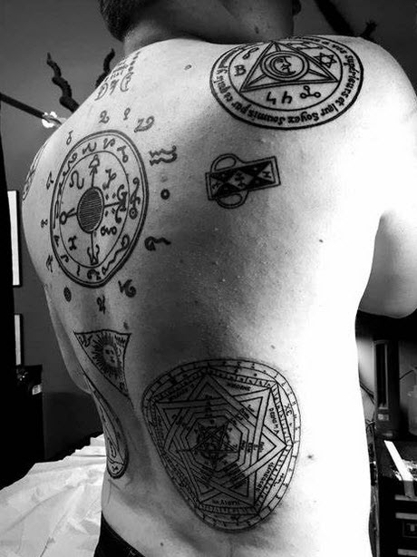Tattoo with occult symbology. You must be absolutely certain, and positive that you can live with the consequences of attachments to various iconology.