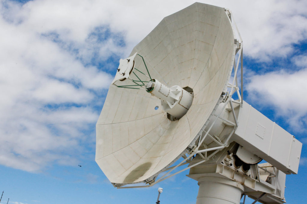 A radar dish aboard Mobile At-Sea Sensor (MATSS) barge (IX-524) undergoes final testing before upcoming flight test mission FTM-16. MATSS provides advanced remote telecommunications capability that extends the reach of the 42,000 square-mile Pacific Missile Range, the world’s largest instrumented multi-environmental range capable of supported surface, subsurface, air, and space operations simultaneously.