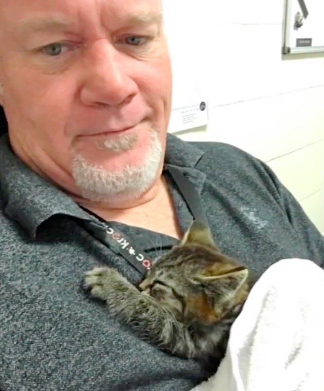 Chuck Hawley and his kitten.