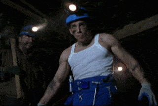 Hollywood idea of a miner with hammer.