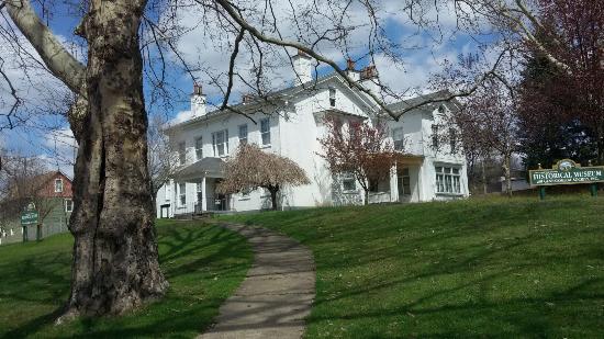“Attractions at the Armstrong County Historical Society and Genealogical Museum” Reviewed April 9, 2015  The house was built in 1842 and houses many rooms. The second floor has theme rooms of Military and Native American and also displays a sewing room and master and child room. The main floor boasts a parlor, dining, kitchen, pantry and McConnell Hall where the displays change yearly. A tour guide walks with you and relates the history of the magnificent home. Next door is what was once the Carriage House where the local genealogical library is now housed with many books of local history and local family history. The helpers are fantastic and do research while you are there or you can contact them via mail.