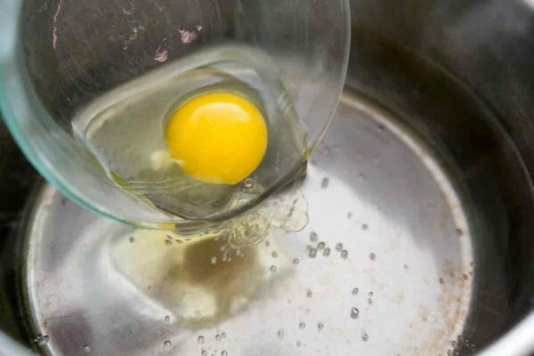 Each world-line resembles a raw egg placed within a pot of warm water with oils and seasonings. Our universe is a big cauldron that is filled with a nearly infinite number of these raw eggs. And time is our consciousness moving from one egg to the next adjacent egg.