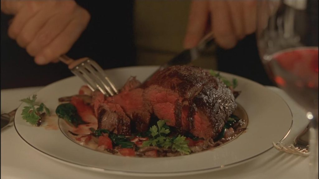 Cypher eating a steak.